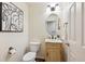 Charming powder room with decorative mirror, vanity, and neutral decor at 10293 Rustic Redwood Ct, Highlands Ranch, CO 80126