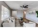 Living room with a comfy couch, coffee table, and large window at 9410 Nagel, Thornton, CO 80229