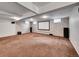 Finished basement with projector screen and speaker system at 6550 E 6Th Avenue Pkwy, Denver, CO 80220