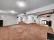Large basement offers ample space for recreation, featuring carpeted floors and a stylish wet bar at 6550 E 6Th Avenue Pkwy, Denver, CO 80220