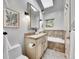 Well-lit bathroom with double vanity, and a soaking tub at 6550 E 6Th Avenue Pkwy, Denver, CO 80220