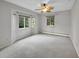 Bright bedroom with a ceiling fan, neutral tones, and lots of natural light from multiple windows at 6550 E 6Th Avenue Pkwy, Denver, CO 80220