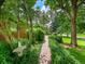 Landscaped walkway leads to the brick home at 6550 E 6Th Avenue Pkwy, Denver, CO 80220