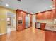 Kitchen with stainless steel appliances and custom wood cabinetry at 6550 E 6Th Avenue Pkwy, Denver, CO 80220