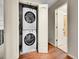 Efficient laundry closet with stacked washer and dryer, providing convenience and space-saving design at 6550 E 6Th Avenue Pkwy, Denver, CO 80220