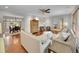 Bright, open living room featuring hardwood floors and an adjacent dining area at 6550 E 6Th Avenue Pkwy, Denver, CO 80220