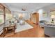 Bright living room with hardwood floors, neutral decor, and ample seating at 6550 E 6Th Avenue Pkwy, Denver, CO 80220