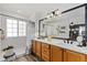 Bathroom featuring double sinks, and a stand-up shower at 107 Prairie Falcon Pkwy, Brighton, CO 80601