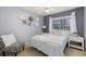 Charming bedroom with a neutral color scheme, decorative pillows, and natural light at 107 Prairie Falcon Pkwy, Brighton, CO 80601
