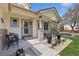 Inviting front porch featuring neutral paint colors, an exterior door, and decorative landscaping at 107 Prairie Falcon Pkwy, Brighton, CO 80601