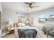 Spacious bedroom with a ceiling fan and large windows at 739 Widgeon Cir, Longmont, CO 80503