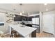 Modern kitchen with white countertops and dark cabinets at 739 Widgeon Cir, Longmont, CO 80503