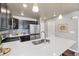 Modern kitchen with white quartz countertops at 739 Widgeon Cir, Longmont, CO 80503