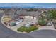 Aerial of a brick house with a circular driveway and well-maintained landscaping at 14581 E Oberlin Pl, Aurora, CO 80014