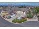 Aerial view of the home showcasing manicured landscaping, driveway, and a three-car garage at 14581 E Oberlin Pl, Aurora, CO 80014