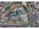 Overhead aerial view of a stunning home featuring a well-manicured lawn and circular driveway at 14581 E Oberlin Pl, Aurora, CO 80014