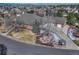 Aerial view of a brick home featuring lush landscaping and a long driveway at 14581 E Oberlin Pl, Aurora, CO 80014