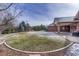 Spacious backyard with green lawn and brick patio, perfect for outdoor enjoyment at 14581 E Oberlin Pl, Aurora, CO 80014