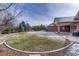 Expansive backyard featuring lush green grass and mature trees, perfect for outdoor enjoyment at 14581 E Oberlin Pl, Aurora, CO 80014