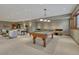 Basement with a pool table provides recreation space in this well lit, carpeted, comfortable living area at 14581 E Oberlin Pl, Aurora, CO 80014