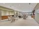 Spacious basement with entertainment area, dining area, and built in kitchenette at 14581 E Oberlin Pl, Aurora, CO 80014