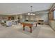 Basement game area with pool table, ping pong table, and seating at 14581 E Oberlin Pl, Aurora, CO 80014