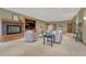 Basement living area with fireplace, television, and seating area at 14581 E Oberlin Pl, Aurora, CO 80014