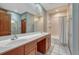 Bathroom features a large double vanity, plenty of lighting and a shower-tub combo at 14581 E Oberlin Pl, Aurora, CO 80014