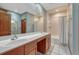 Bathroom featuring double sinks and a bathtub with shower head at 14581 E Oberlin Pl, Aurora, CO 80014