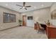Comfortable bedroom with carpet floors, a ceiling fan, and plenty of natural light at 14581 E Oberlin Pl, Aurora, CO 80014