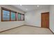 This comfortable bedroom is filled with natural light from the three large windows at 14581 E Oberlin Pl, Aurora, CO 80014