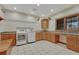 Functional laundry room with washer, dryer, built-in cabinets, and ample counter space at 14581 E Oberlin Pl, Aurora, CO 80014
