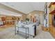 Open-concept living room flowing into a gourmet kitchen, featuring hardwood floors and a cozy seating area at 14581 E Oberlin Pl, Aurora, CO 80014