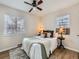 Cozy bedroom featuring hardwood floors, natural light, and a comfortable sleeping space at 3440 N Steele St, Denver, CO 80205