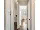 Bright hallway features hardwood floors, fresh paint, and views into the adjacent living spaces at 3440 N Steele St, Denver, CO 80205