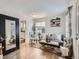 Bright living room featuring hardwood floors, a comfortable couch, and stylish decor at 3440 N Steele St, Denver, CO 80205