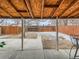 Covered patio overlooks the backyard and features a concrete floor and wood supports at 3440 N Steele St, Denver, CO 80205