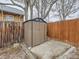 Backyard features convenient storage shed with concrete pad and fenced perimeter at 3440 N Steele St, Denver, CO 80205