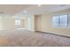 Spacious basement featuring neutral walls, carpet floors, recessed lighting, and natural light from multiple windows at 16021 Verbena St, Brighton, CO 80602