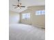 Large bedroom with vaulted ceilings, natural light, and plush carpeting at 16021 Verbena St, Brighton, CO 80602