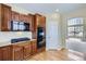 Well-equipped kitchen featuring wooden cabinetry, granite countertops, and stainless steel appliances at 16021 Verbena St, Brighton, CO 80602