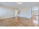 Inviting living room with hardwood floors and an open layout to the foyer and staircase at 16021 Verbena St, Brighton, CO 80602