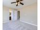 Spacious main bedroom with plush carpet, neutral paint, and ensuite bath at 16021 Verbena St, Brighton, CO 80602