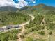 Aerial view of property with mountain views and extensive tree cover at 5225 Mesa Top Dr, Monument, CO 80132