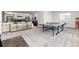 Spacious basement with a ping pong table, entertainment area, and stylish decor at 5225 Mesa Top Dr, Monument, CO 80132