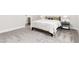 Cozy bedroom with plush carpet, soft lighting, and access to a modern bathroom at 5225 Mesa Top Dr, Monument, CO 80132