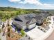Stunning aerial view of a house with a driveway, landscaping, and mountain views at 5225 Mesa Top Dr, Monument, CO 80132