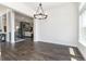 Open-concept living room featuring hardwood flooring, fireplace, and plenty of natural light at 5225 Mesa Top Dr, Monument, CO 80132