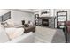 Bright living room featuring a stone fireplace, comfortable seating, and modern decor at 5225 Mesa Top Dr, Monument, CO 80132
