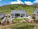 Back of house with a cozy patio, well-kept lawn, and a beautiful fire pit area at 5225 Mesa Top Dr, Monument, CO 80132